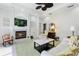 Living room featuring a fireplace and built-in shelving at 1010 Grouse Way, Venice, FL 34285