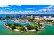 Breathtaking aerial view of a waterfront community with a marina and city skyline backdrop at 110 Vista Hermosa Cir # 102B, Sarasota, FL 34242