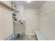 Laundry closet with AC unit and shelving at 110 Vista Hermosa Cir # 102B, Sarasota, FL 34242