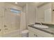 Clean bathroom, featuring a vanity with a granite countertop at 1102 Auburn Cove Cir, Venice, FL 34292