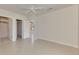 Bedroom with ceiling fan and access to bathroom and closet at 1102 Auburn Cove Cir, Venice, FL 34292