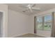 Bright bedroom with ceiling fan and large window at 1102 Auburn Cove Cir, Venice, FL 34292