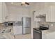 Modern kitchen with stainless steel appliances and granite counters at 1102 Auburn Cove Cir, Venice, FL 34292