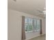 Spacious living room with large window and ceiling fan at 1102 Auburn Cove Cir, Venice, FL 34292
