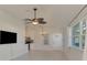 Spacious living room, tile floors, and a chandelier at 1102 Auburn Cove Cir, Venice, FL 34292