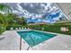 Refreshing community pool with ample surrounding space at 1102 Auburn Cove Cir, Venice, FL 34292