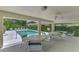 Community pool with covered patio and seating at 1102 Auburn Cove Cir, Venice, FL 34292