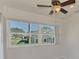 Sunroom with tile floors and large windows offering a neighborhood view at 1102 Auburn Cove Cir, Venice, FL 34292