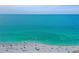 Aerial view of a beach with swimmers and beachgoers at 1106 Bird Bay Way # 316, Venice, FL 34285
