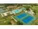 Community tennis courts and pool area at 1106 Bird Bay Way # 316, Venice, FL 34285