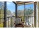 Relaxing balcony with wicker furniture and scenic views at 1106 Bird Bay Way # 316, Venice, FL 34285