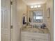 Elegant bathroom boasts granite countertops, brushed nickel fixtures, and a modern design at 1106 Bird Bay Way # 316, Venice, FL 34285