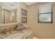 Bathroom with granite countertop and updated vanity at 1106 Bird Bay Way # 316, Venice, FL 34285