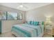 Bedroom with a king-size bed and serene window views at 1106 Bird Bay Way # 316, Venice, FL 34285