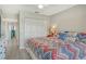 Spacious bedroom with king-size bed and access to another bedroom at 1106 Bird Bay Way # 316, Venice, FL 34285