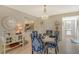 Charming dining area with a modern chandelier and stylish furnishings, perfect for entertaining guests at 1106 Bird Bay Way # 316, Venice, FL 34285