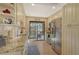 Bright kitchen with stainless appliances, granite countertops, and views to balcony at 1106 Bird Bay Way # 316, Venice, FL 34285