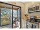 Kitchen with stainless steel appliances and access to a balcony at 1106 Bird Bay Way # 316, Venice, FL 34285