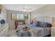 Main bedroom with king-size bed and tray with coffee cups at 1106 Bird Bay Way # 316, Venice, FL 34285