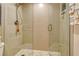 Walk-in shower with glass enclosure and pebble floor at 1106 Bird Bay Way # 316, Venice, FL 34285