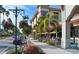 Outdoor seating at restaurants and shops along a street at 1106 Bird Bay Way # 316, Venice, FL 34285
