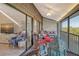 Spacious sunroom with scenic views and wicker furniture at 1106 Bird Bay Way # 316, Venice, FL 34285