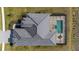 Aerial view of the home showcasing the roof, pool, and surrounding landscape at 11140 Hogan Cir, Englewood, FL 34223