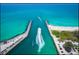 Gorgeous aerial view of boats entering and exiting the ocean on a bright, sunny day at 11140 Hogan Cir, Englewood, FL 34223