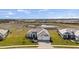 Stunning aerial perspective of home site featuring expansive lawns at 11140 Hogan Cir, Englewood, FL 34223