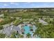 Breathtaking aerial view of a resort-style pool and lush community landscaping at 11140 Hogan Cir, Englewood, FL 34223