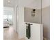 Modern bathroom with walk-in shower, tile surround, and view into the primary bedroom at 11140 Hogan Cir, Englewood, FL 34223