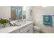 Bright bathroom with white marble countertop and modern fixtures at 11140 Hogan Cir, Englewood, FL 34223