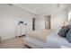 Bedroom featuring a comfy bed, wood-look flooring, and bright white walls and furniture at 11140 Hogan Cir, Englewood, FL 34223