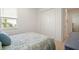Charming bedroom with a cozy bed and closet at 11140 Hogan Cir, Englewood, FL 34223