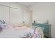 Inviting bedroom with patterned bedding and soft pastel accents at 11140 Hogan Cir, Englewood, FL 34223