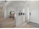 Inviting entryway featuring wood-look flooring and a glimpse into the dining area at 11140 Hogan Cir, Englewood, FL 34223
