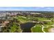 Scenic golf course with multiple greens, lakes, and lush landscaping at 11140 Hogan Cir, Englewood, FL 34223