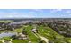 A golf course offers a picturesque view with lush greens and water features at 11140 Hogan Cir, Englewood, FL 34223