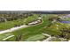 Picturesque golf course with lush green fairways and mature trees at 11140 Hogan Cir, Englewood, FL 34223
