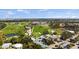 Aerial view of a beautiful golf course, clubhouse, and community at 11140 Hogan Cir, Englewood, FL 34223