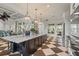 Spacious open kitchen overlooks the clubhouse area, featuring stainless appliances and granite countertops at 11140 Hogan Cir, Englewood, FL 34223