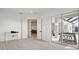 Open floor plan with tile floors, white trim, and a view of the outdoor living space at 11140 Hogan Cir, Englewood, FL 34223