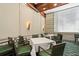 Comfortable meeting room features ample seating, with green chairs and neutral walls, for professional gatherings at 11140 Hogan Cir, Englewood, FL 34223