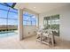 Outdoor bar with seating and a view of the pool and lush landscaping at 11140 Hogan Cir, Englewood, FL 34223