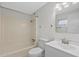 Clean bathroom with a tub, toilet, and vanity with modern fixtures at 115 White Oak Way, Sarasota, FL 34237