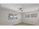 Well-lit bedroom featuring wood-look floors and dual windows at 115 White Oak Way, Sarasota, FL 34237