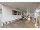 Covered carport with concrete slab at 115 White Oak Way, Sarasota, FL 34237