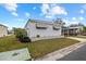Landscaped mobile home with carport at 115 White Oak Way, Sarasota, FL 34237