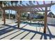 Community hot tub with pergola cover at 115 White Oak Way, Sarasota, FL 34237