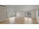 Spacious living room with laminate flooring and sliding glass doors at 115 White Oak Way, Sarasota, FL 34237